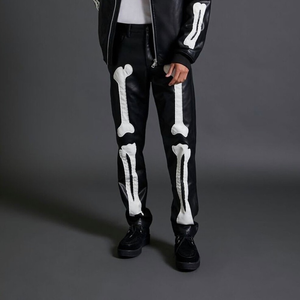 NWT black faux leather skeleton pants .